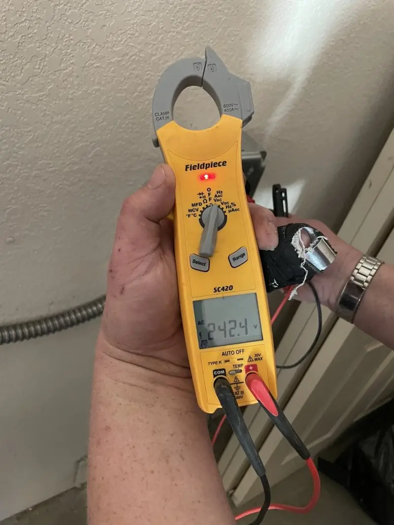 Voltage testing with clamp meter during Electrical Installation Services in Tierra Verde